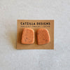 orange speckled studs