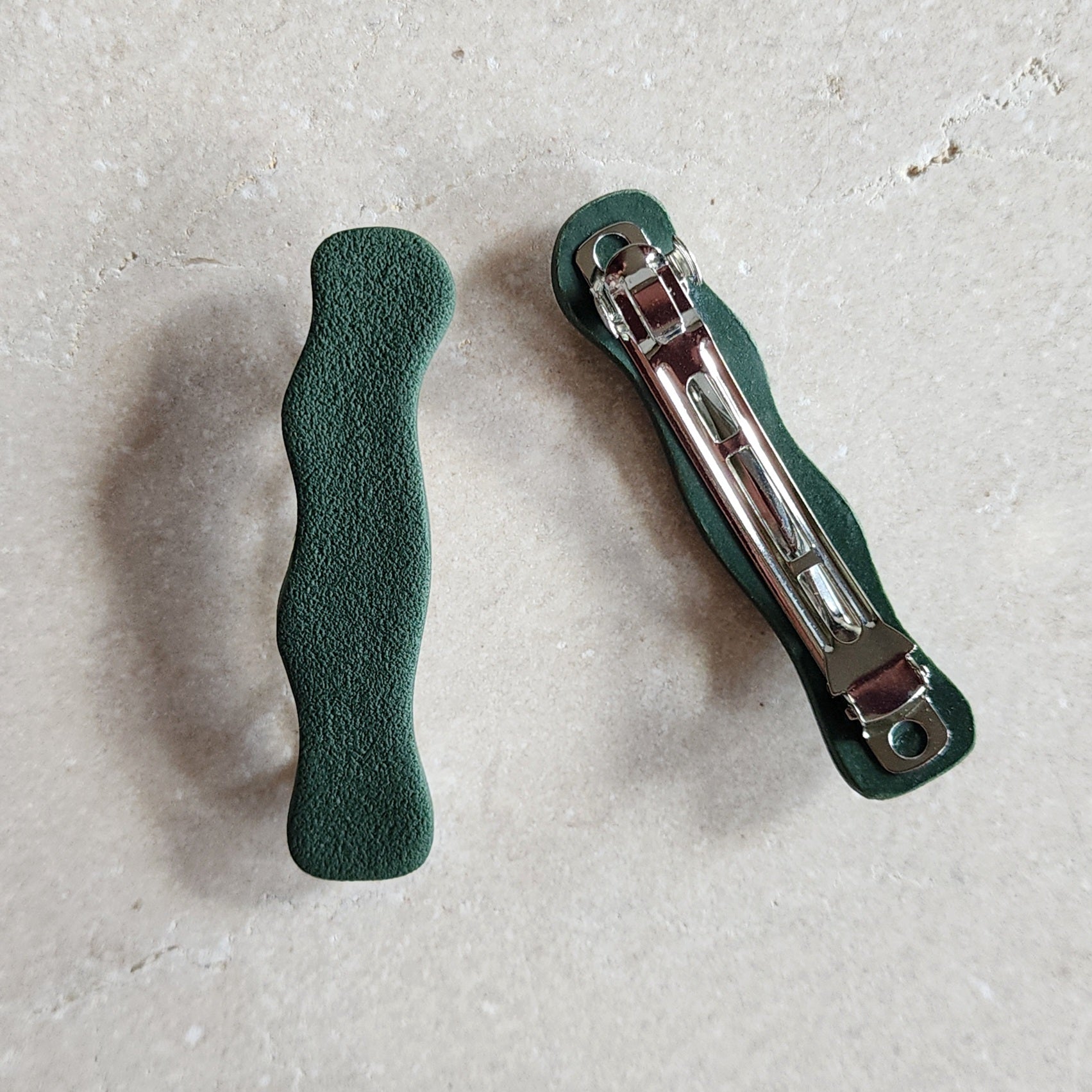 wavy dark green barrettes