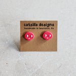 hot pink skull studs