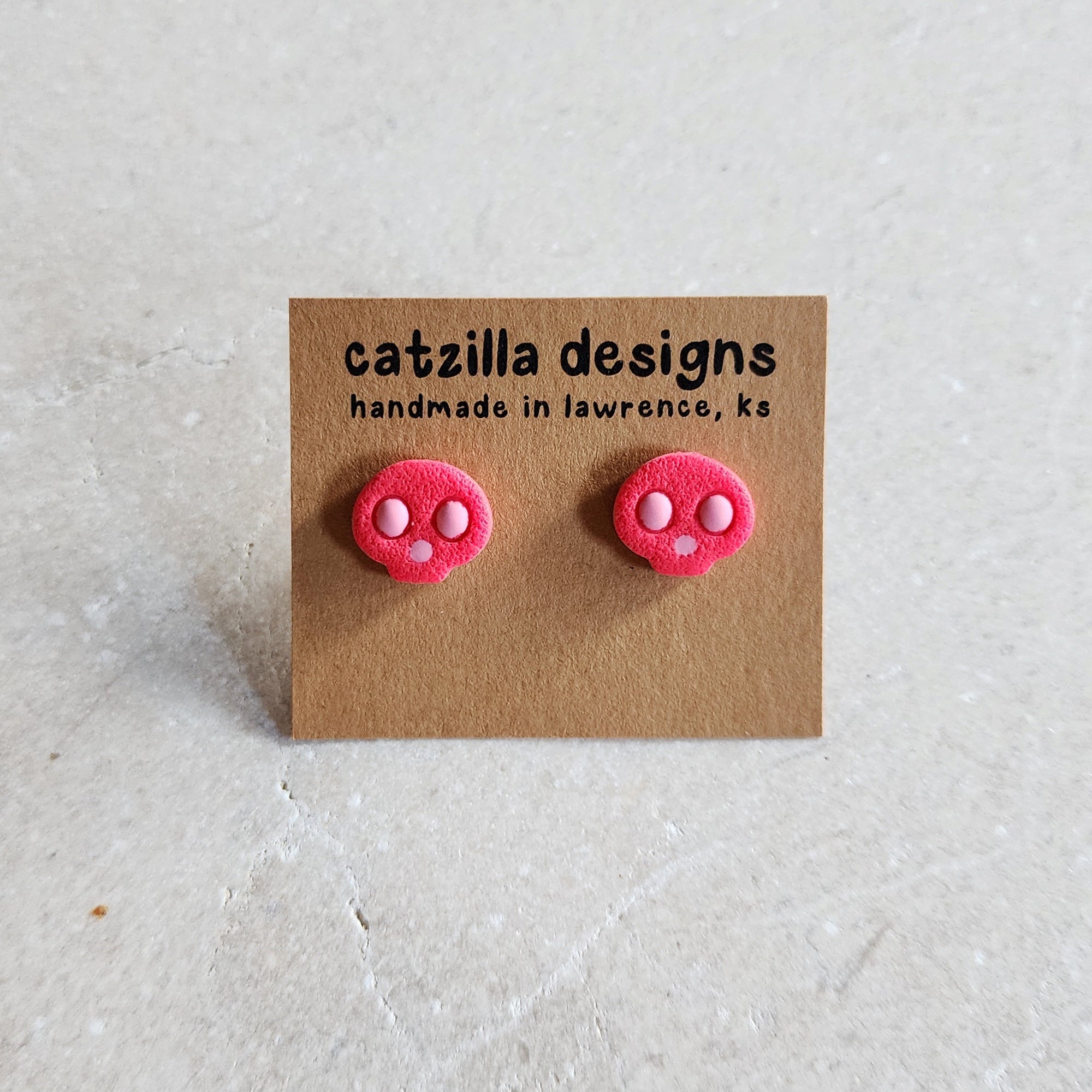 hot pink skull studs