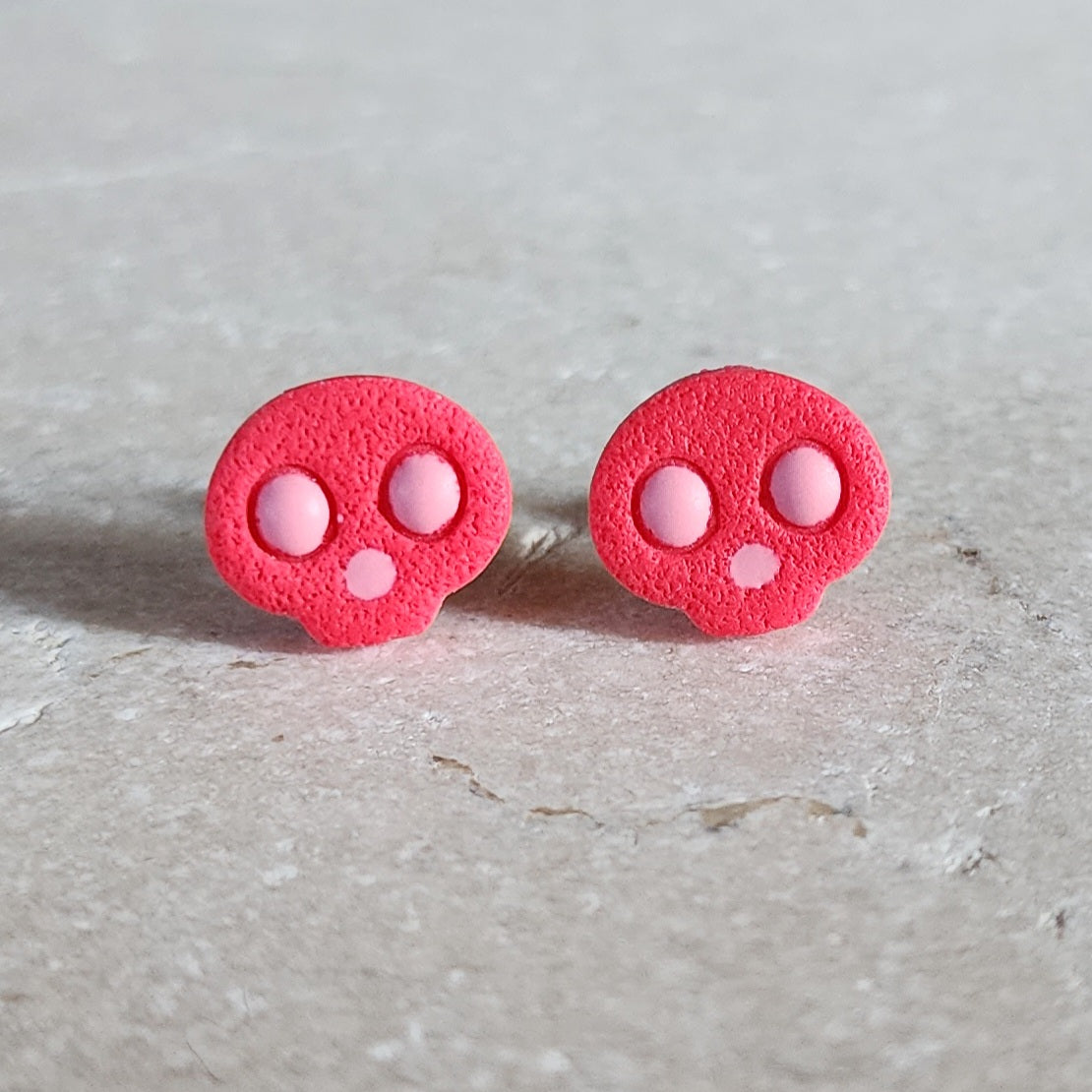 hot pink skull studs