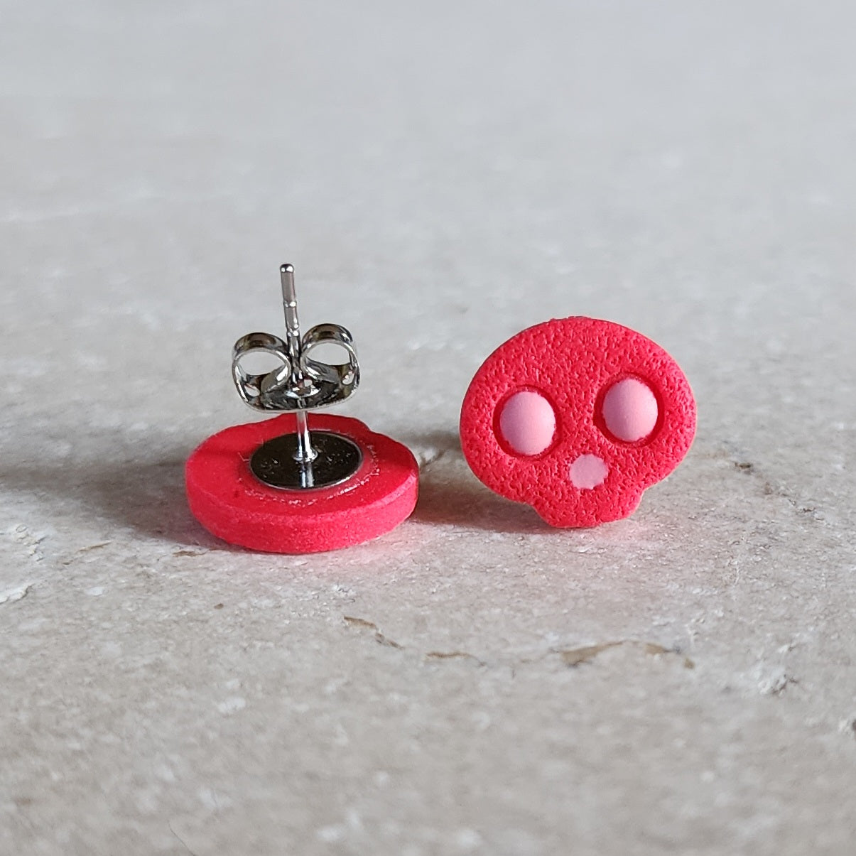 hot pink skull studs